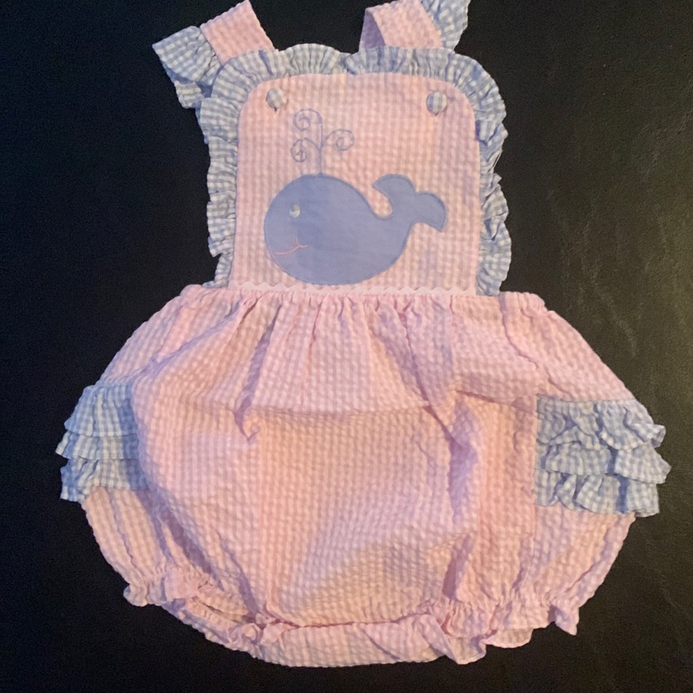 Blue and pink smocked whale onesie.